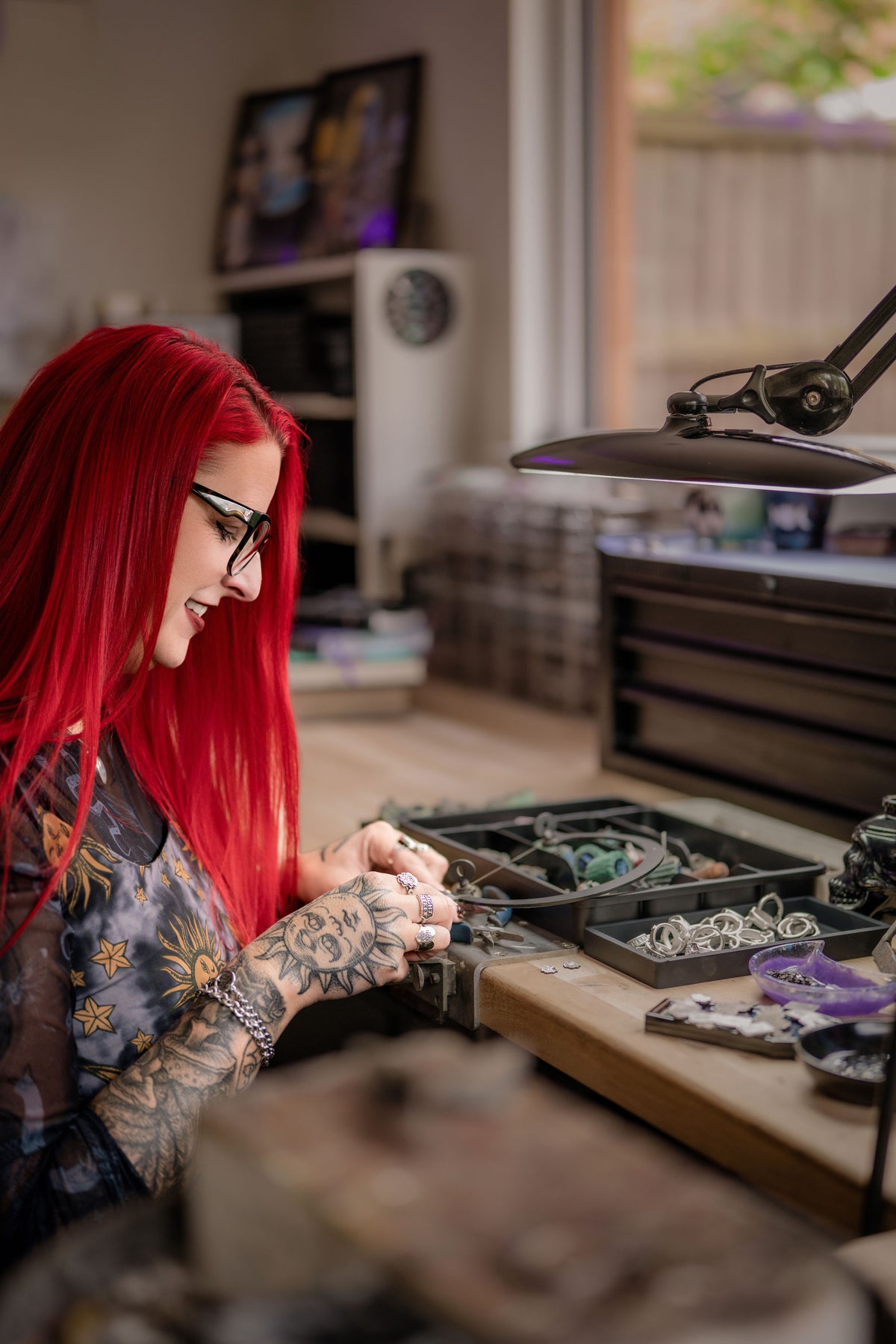 Sam Ryde soldering a piece at her bench